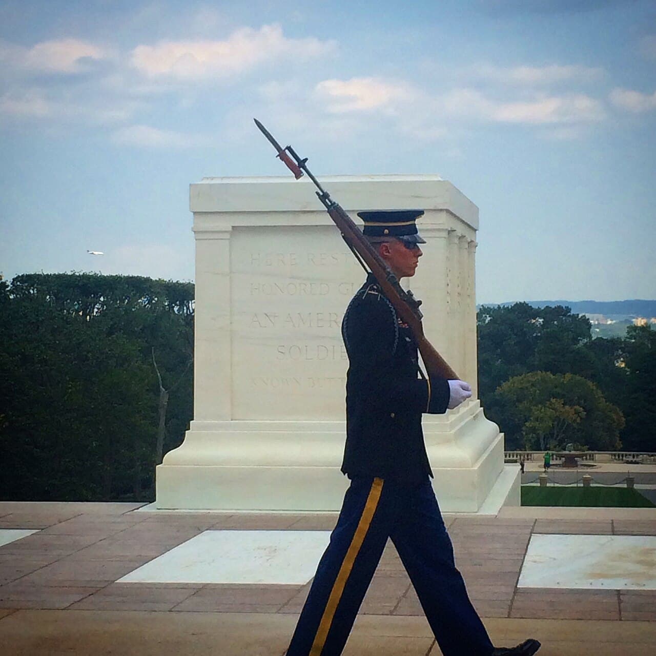 Sentinel walking guard in front of the Tomb of the Unknown Soldier at Arlington National Cemetery